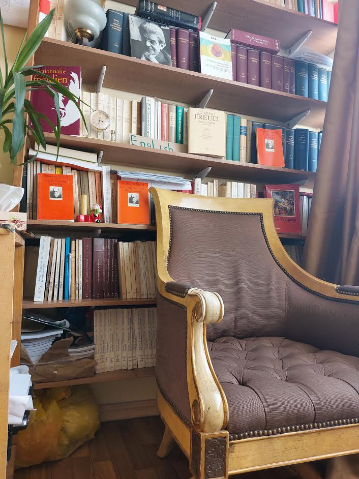 Psychoanalytic library with classic armchair and psychology books